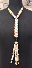 Load image into Gallery viewer, NECKLACE VERY LONG WITH HANDCARVIG ELEMENTS IN IVORY COLOUR - BLACK COTTON CORD - FROM NEPAL
