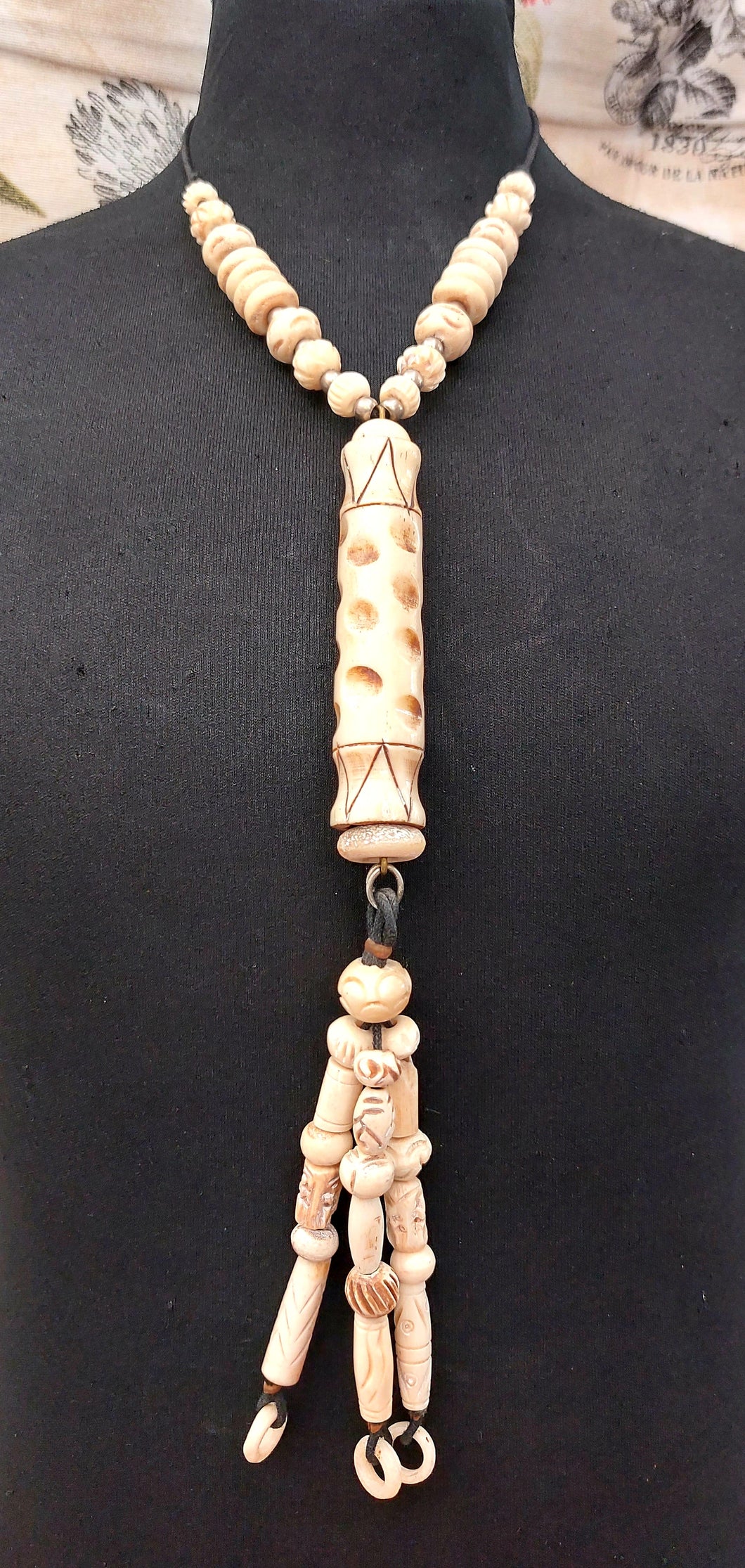 NECKLACE VERY LONG WITH HANDCARVIG ELEMENTS IN IVORY COLOUR - BLACK COTTON CORD - FROM NEPAL